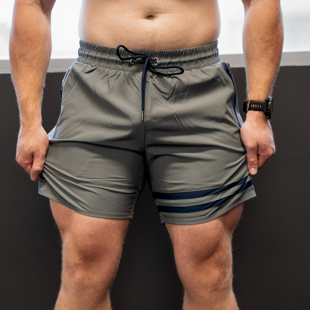 IXK Gear Quick Dry Shorts in Colour: Grey. Plain dark background.