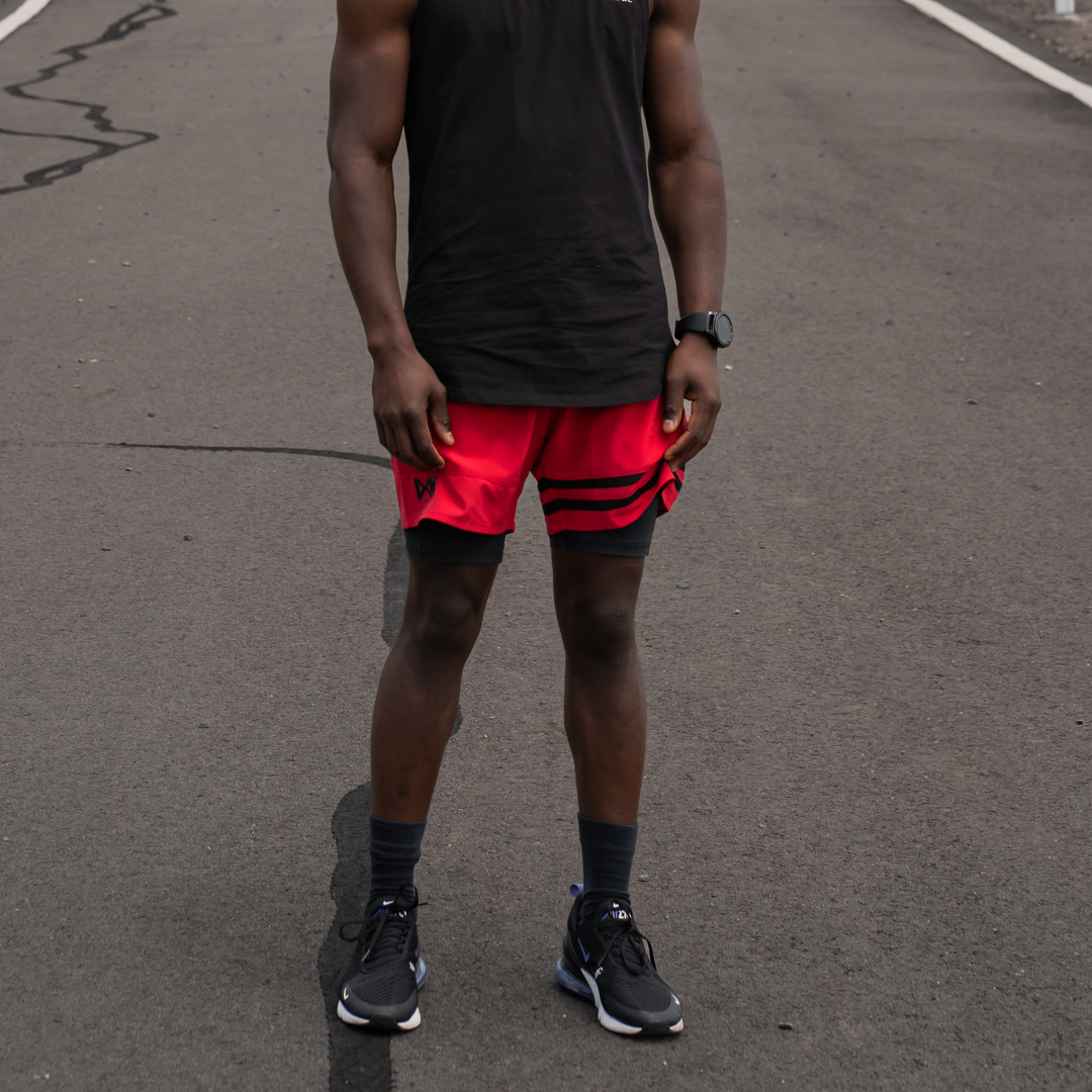 IXK Gear Quick Dry Accent Shorts in Colour: Red. Natural background. Paired with IXK Gear Muscle Tank in Colour: Black.