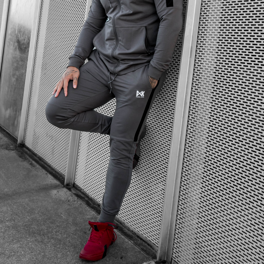 IXK Gear Men's Tracksuit in Colour: Charcoal. Metal Mesh Background.