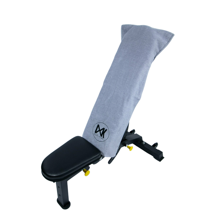 Demonstration of IXK Gear Gym Towel with hood being used over a gym bench