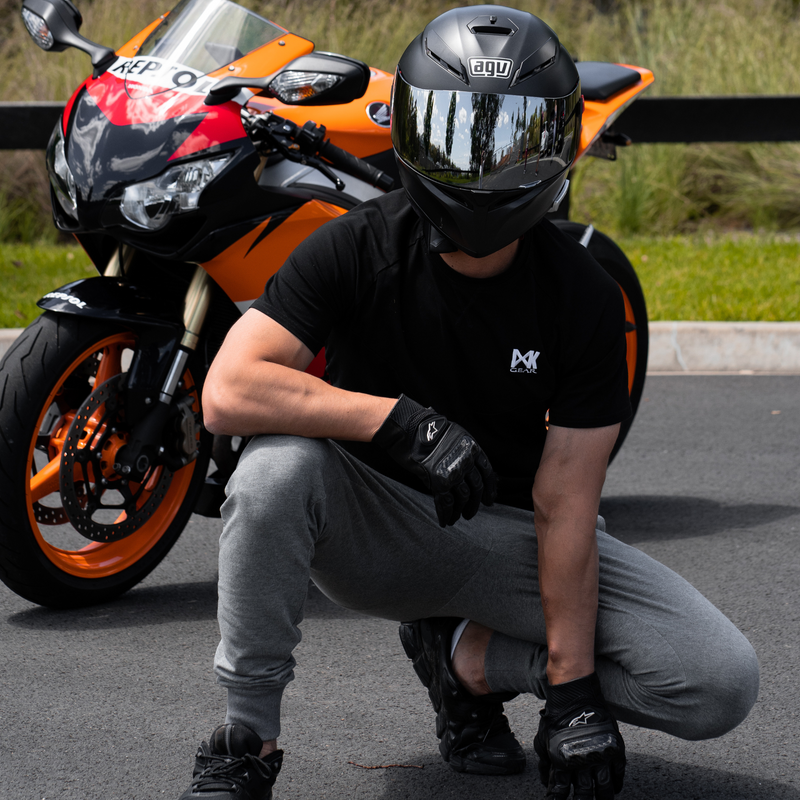 IXK Gear Cotton Tee in Black and Grey Slim Sweats. Bike in the background.