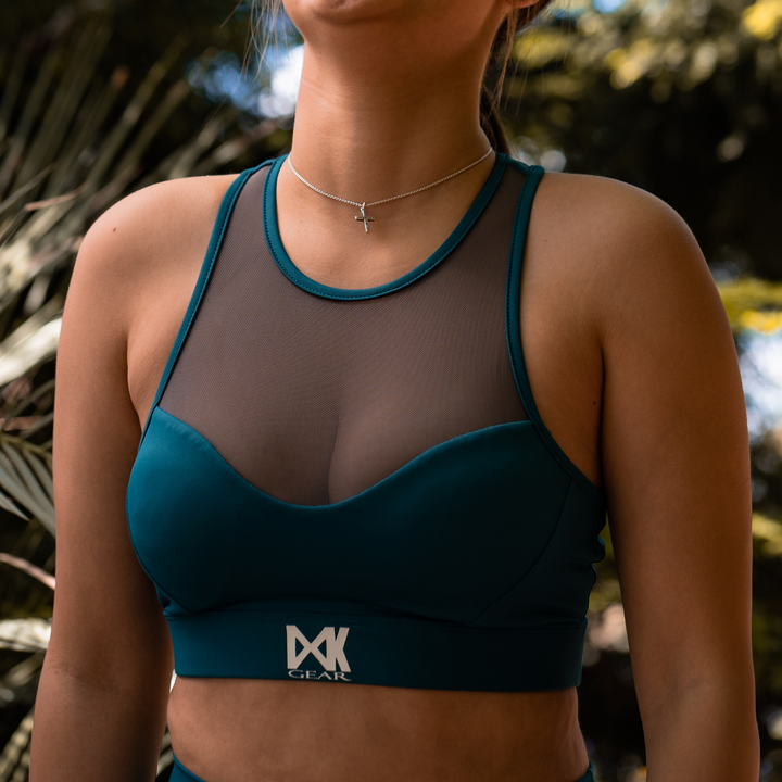 IXK Gear Mesh Sports Bra in Colour: Teal paired with NV Tights in Teal. Natural Background.