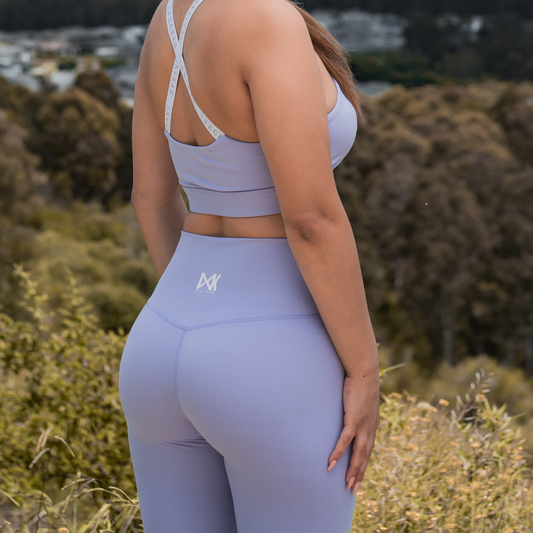 IXK Gear NV Tights in Colour: Lavender, paired with IXK X Sports Bra in Lavender. Natural background.