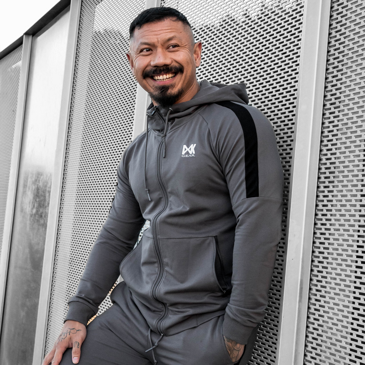 IXK Gear Men's Tracksuit in Colour: Charcoal. Metal Mesh Background.